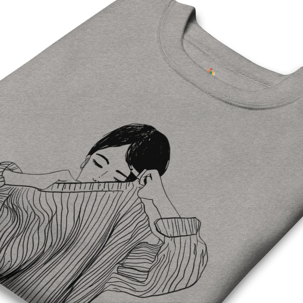 Gray t-shirt with a black and white illustration of a person holding a striped fabric.