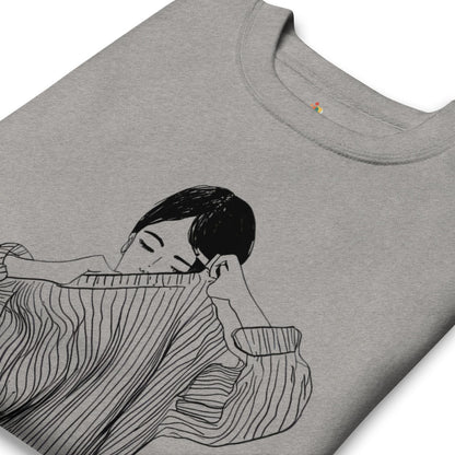 Gray t-shirt with a black and white illustration of a person holding a striped fabric.