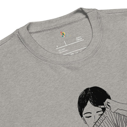 Gray t-shirt with a black and white illustration of a person on the chest area.