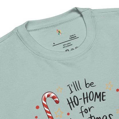 Light blue t-shirt with Christmas-themed text and candy cane design, brand label visible.