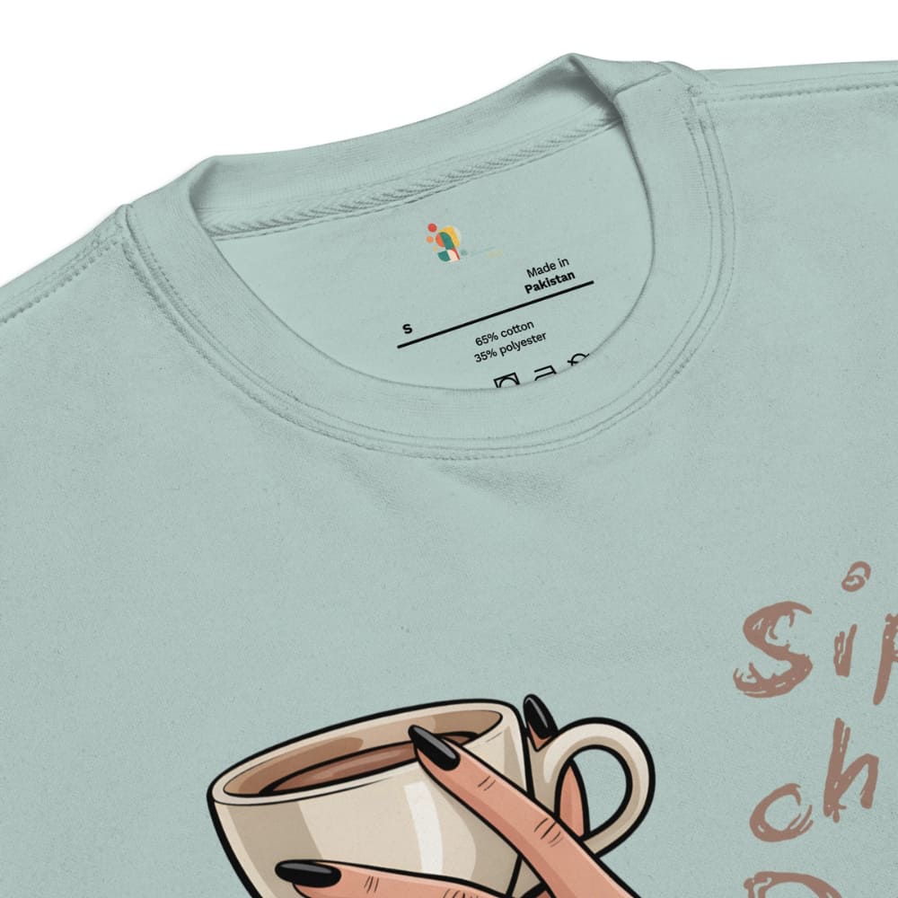 Light blue t-shirt with a graphic of a hand holding a coffee cup and text on a white background