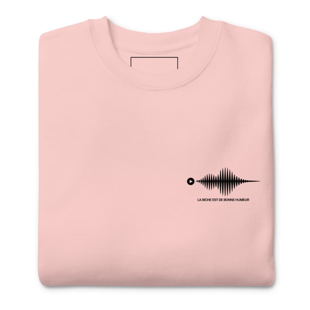 Folded pink sweatshirt with a black graphic and text on a white background