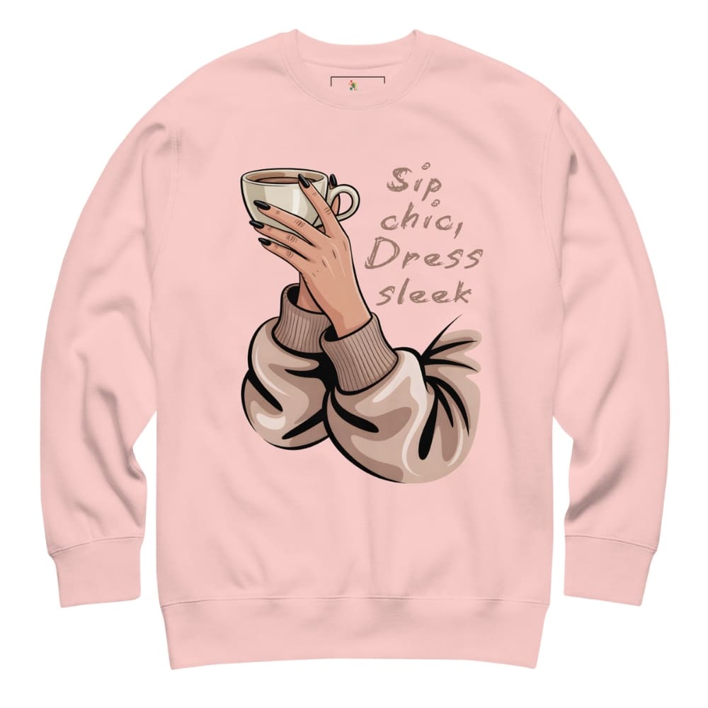 Pink sweatshirt with a graphic of a hand holding a coffee cup and text 'Sip, chic, Dress, sleek' on a white background.