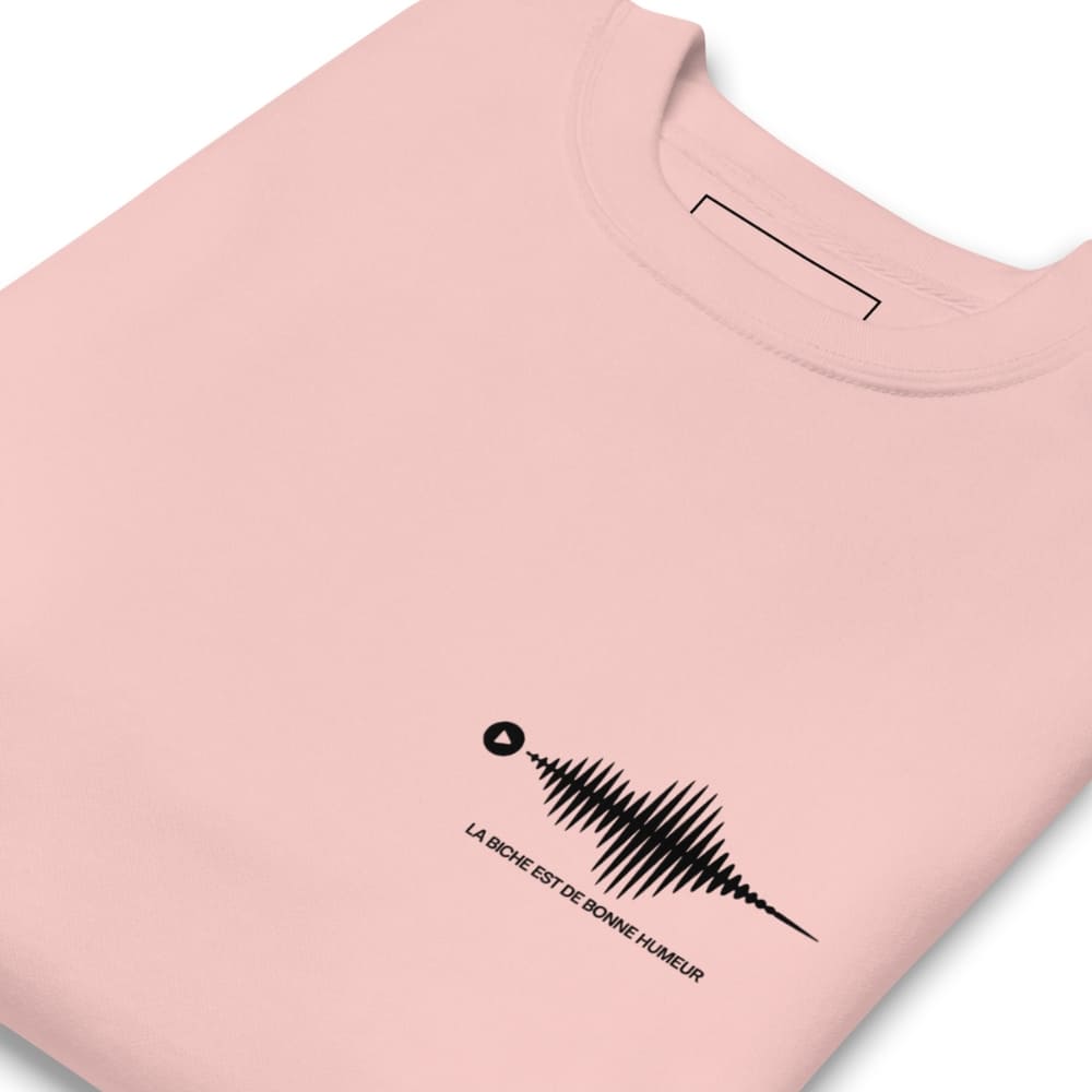 Pink t-shirt with a black sound wave design and text on a white background