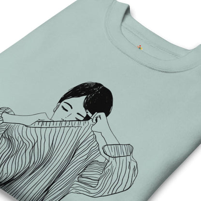 Light blue t-shirt with a black and white illustration of a person holding a cat on a white background