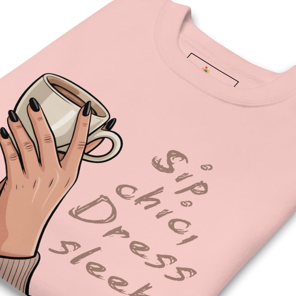 Pink t-shirt with a hand holding a coffee cup and text design on a white background