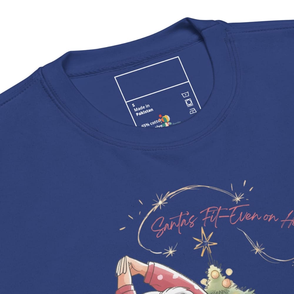 Blue t-shirt with a graphic design and 'Made in Pakistan' label on the collar.