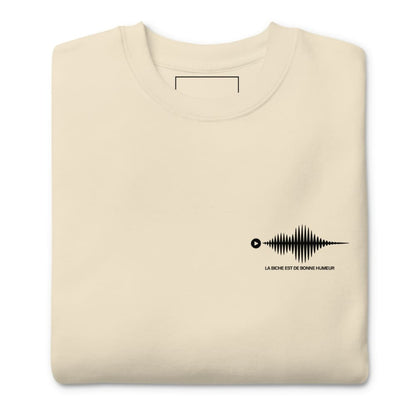 Beige sweatshirt with a black graphic design on a white background