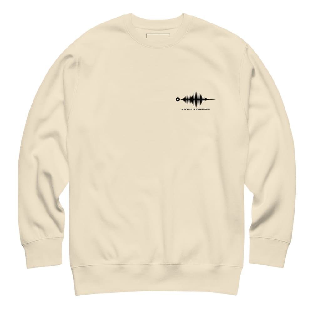 Beige sweatshirt with a black graphic on the chest against a white background