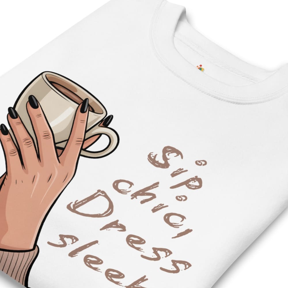 White t-shirt with a hand holding a coffee cup graphic and text 'Sip chic, dress sleek' on a white background.