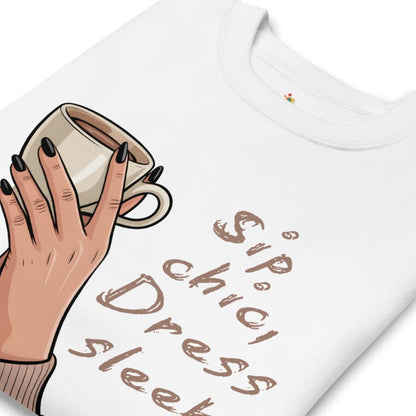 White t-shirt with a hand holding a coffee cup graphic and text 'Sip chic, dress sleek' on a white background.
