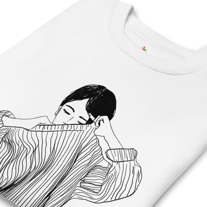 White t-shirt with black line art of a person wearing a dress on a white background
