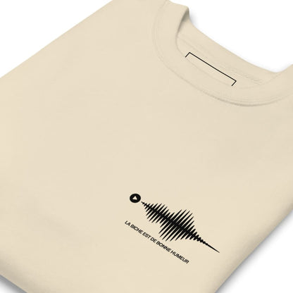 Beige t-shirt with a black graphic design and text on a white background