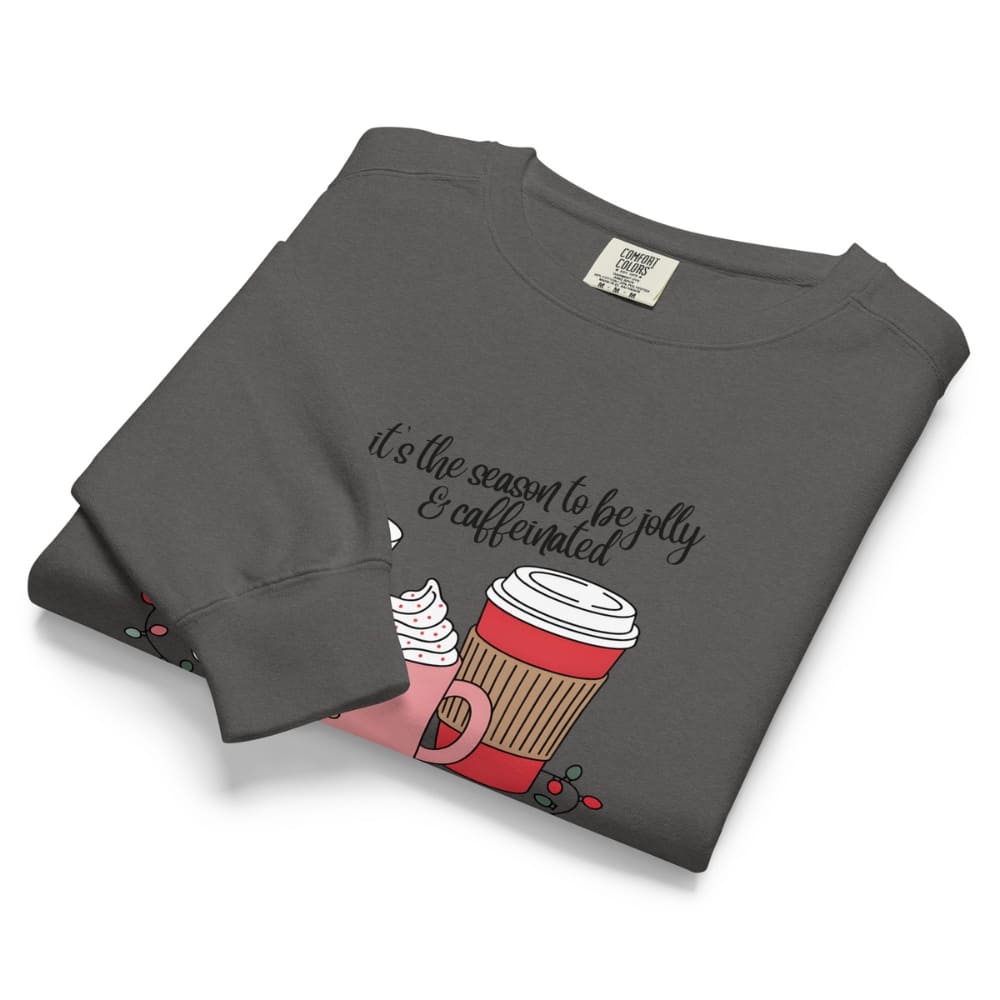 Folded gray sweatshirt with a coffee cup graphic and text on a white background