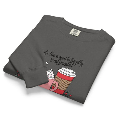 Folded gray sweatshirt with a coffee cup graphic and text on a white background