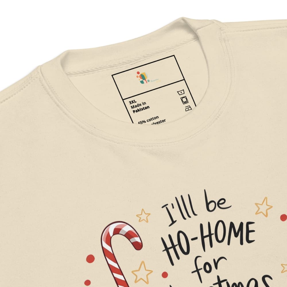 Beige sweatshirt with candy cane design and text 'I'll be ho-home for Christmas' on a white background.