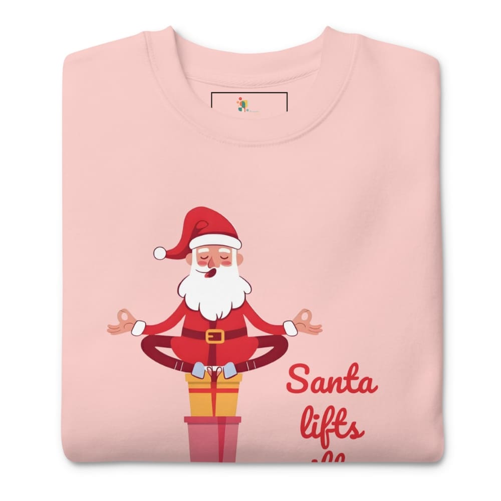 Folded pink t-shirt with a cartoon Santa Claus design and text on a white background