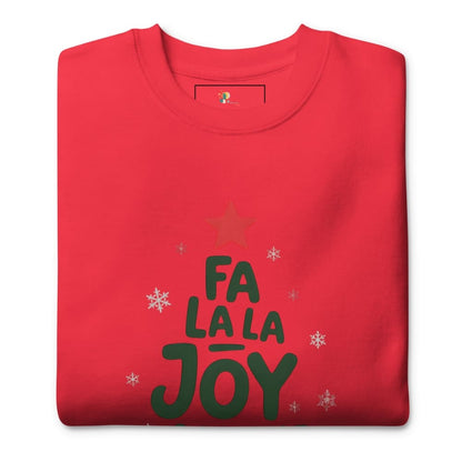 Folded red t-shirt with 'Fa La La Joy' text and star design on a white background