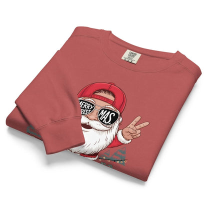 Folded red sweatshirt with a graphic of a Santa Claus giving a peace sign on a white background
