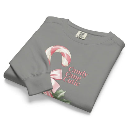 Folded gray sweatshirt with candy cane design and 'Candy Cane Cutie' text on a white background