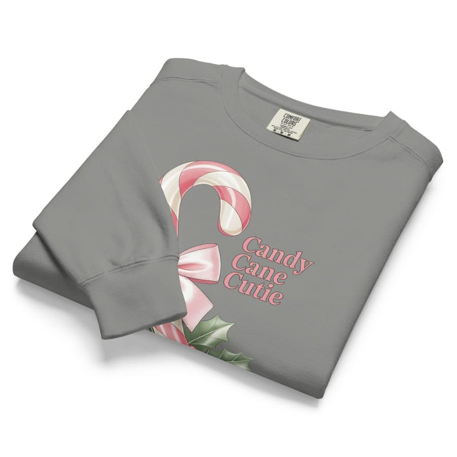 Folded gray sweatshirt with candy cane design and 'Candy Cane Cutie' text on a white background