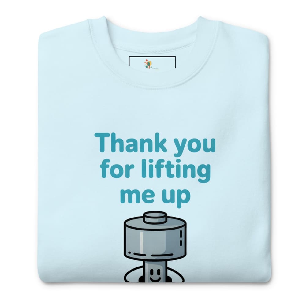 Light blue t-shirt with a cartoon character and text 'Thank you for lifting me up' on a white background