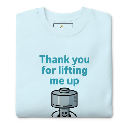 Light blue t-shirt with a cartoon character and text 'Thank you for lifting me up' on a white background