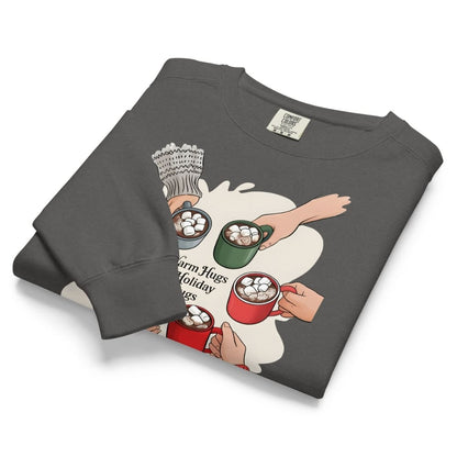 Folded gray sweatshirt with graphic design of hands holding mugs on a white background