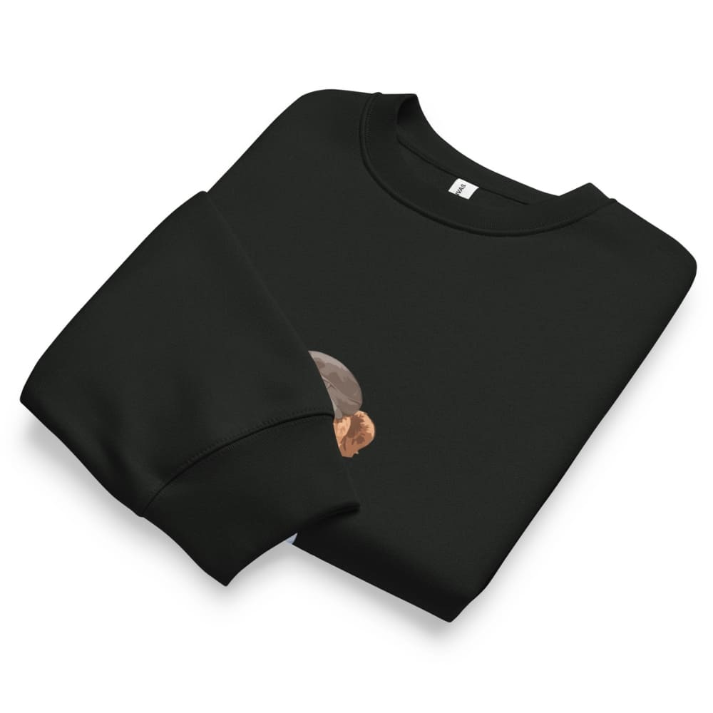 Folded black sweatshirt with a small graphic on a white background