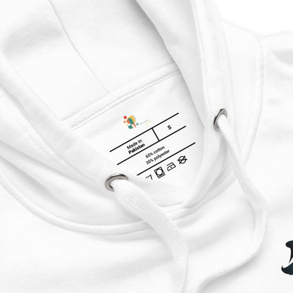 Close-up of a white garment with a label on a white background