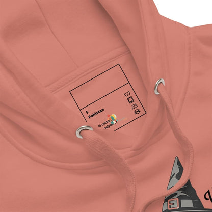 Close-up of a pink hoodie with a label on the chest pocket.