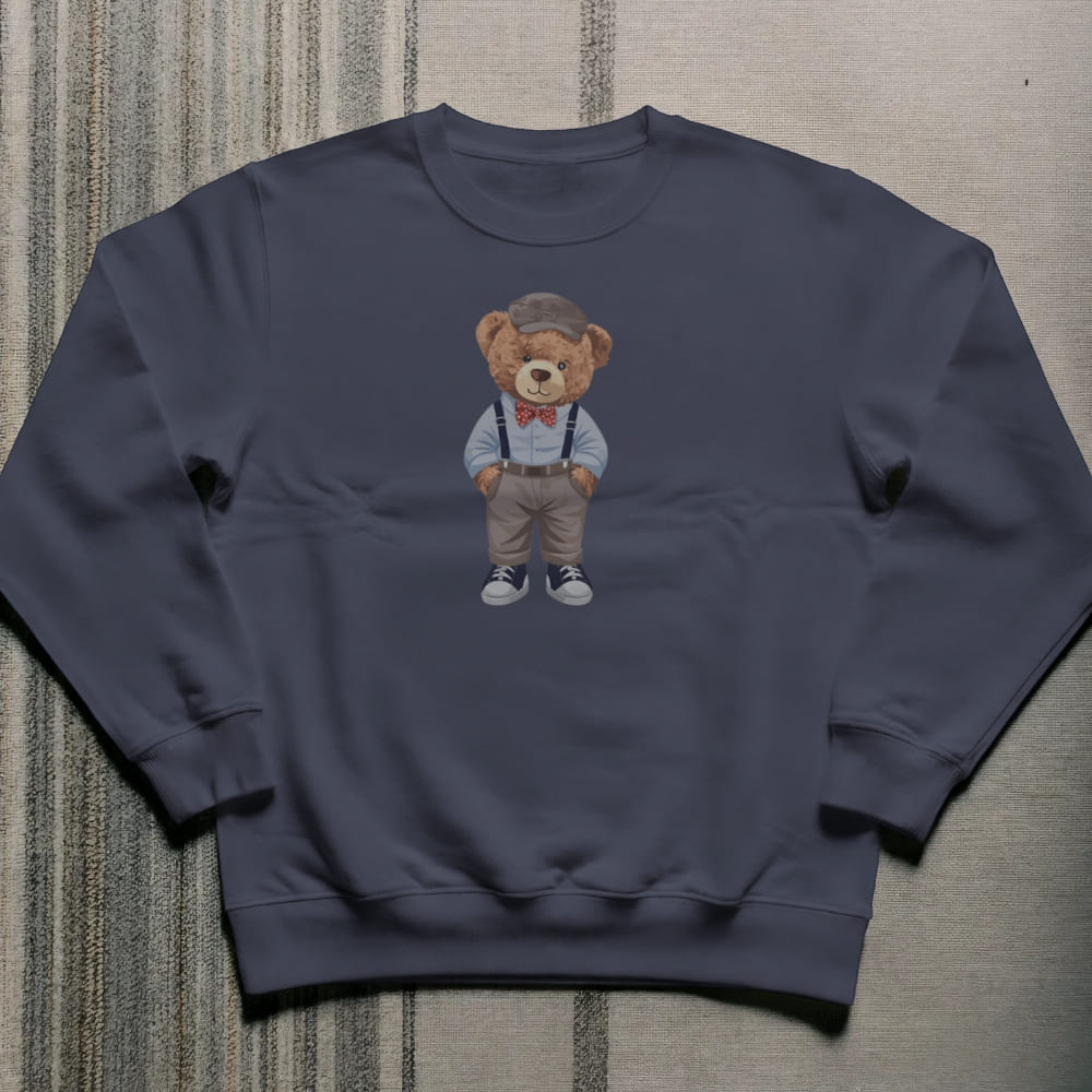 Navy blue sweatshirt with a teddy bear graphic on a textured surface