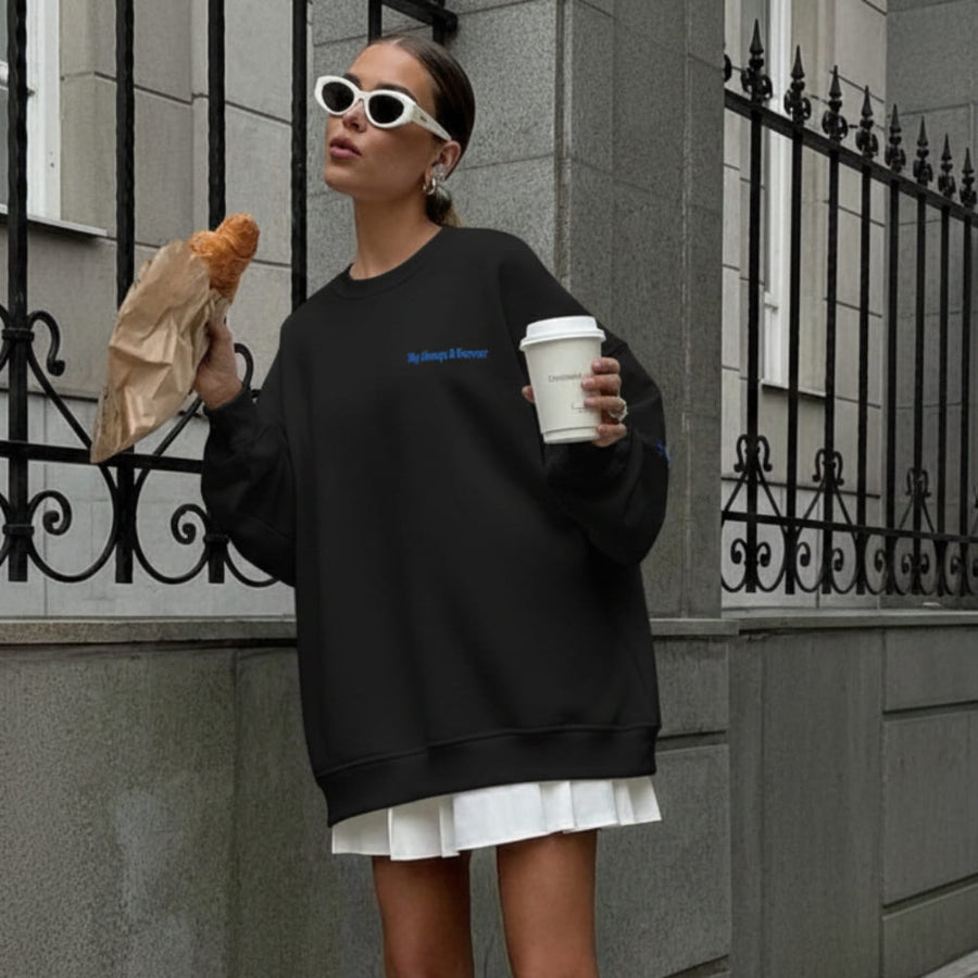 Always & Forever™ oversized sweatshirt by Blossombless.co in Black, lifestyle: woman with a coffee by black iron railings