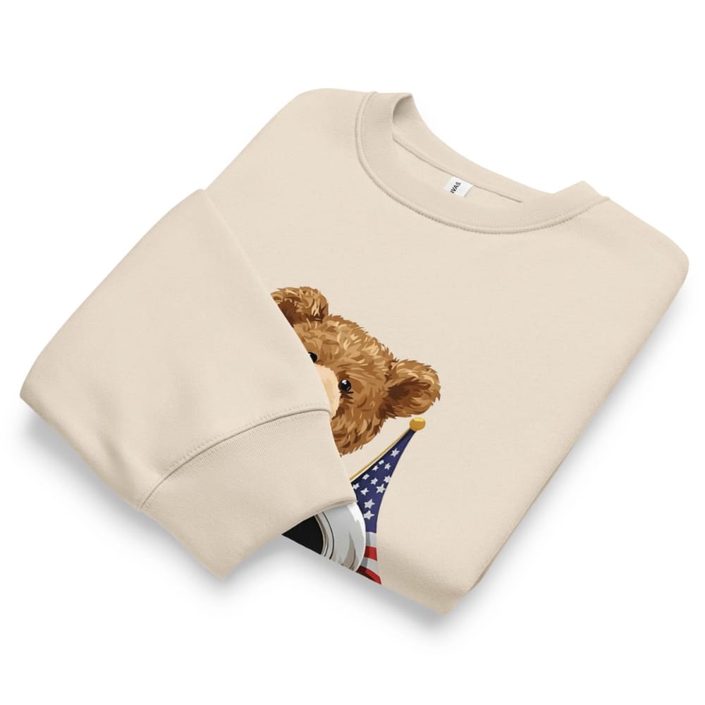 Beige sweatshirt with a teddy bear holding an American flag on a white background