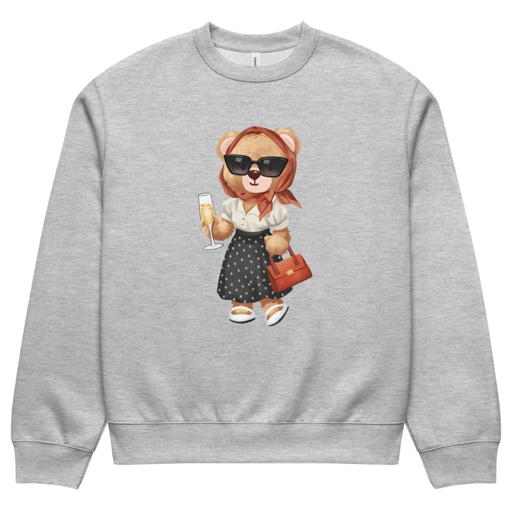 Gray sweatshirt with a cartoon bear design holding a glass of champagne and a handbag on a white background