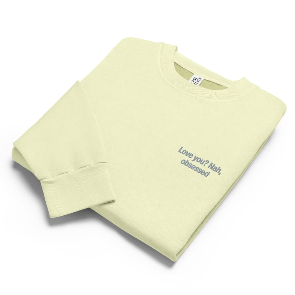 Light green sweatshirt with text on a white background