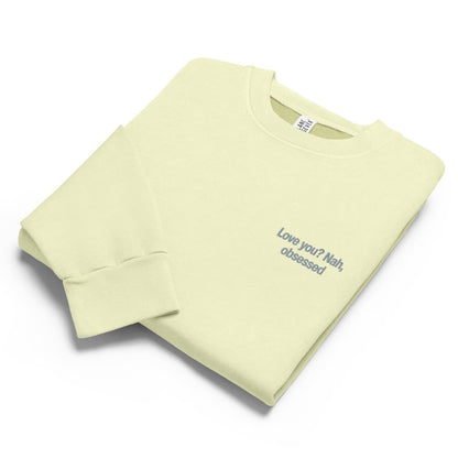 Light green sweatshirt with text on a white background