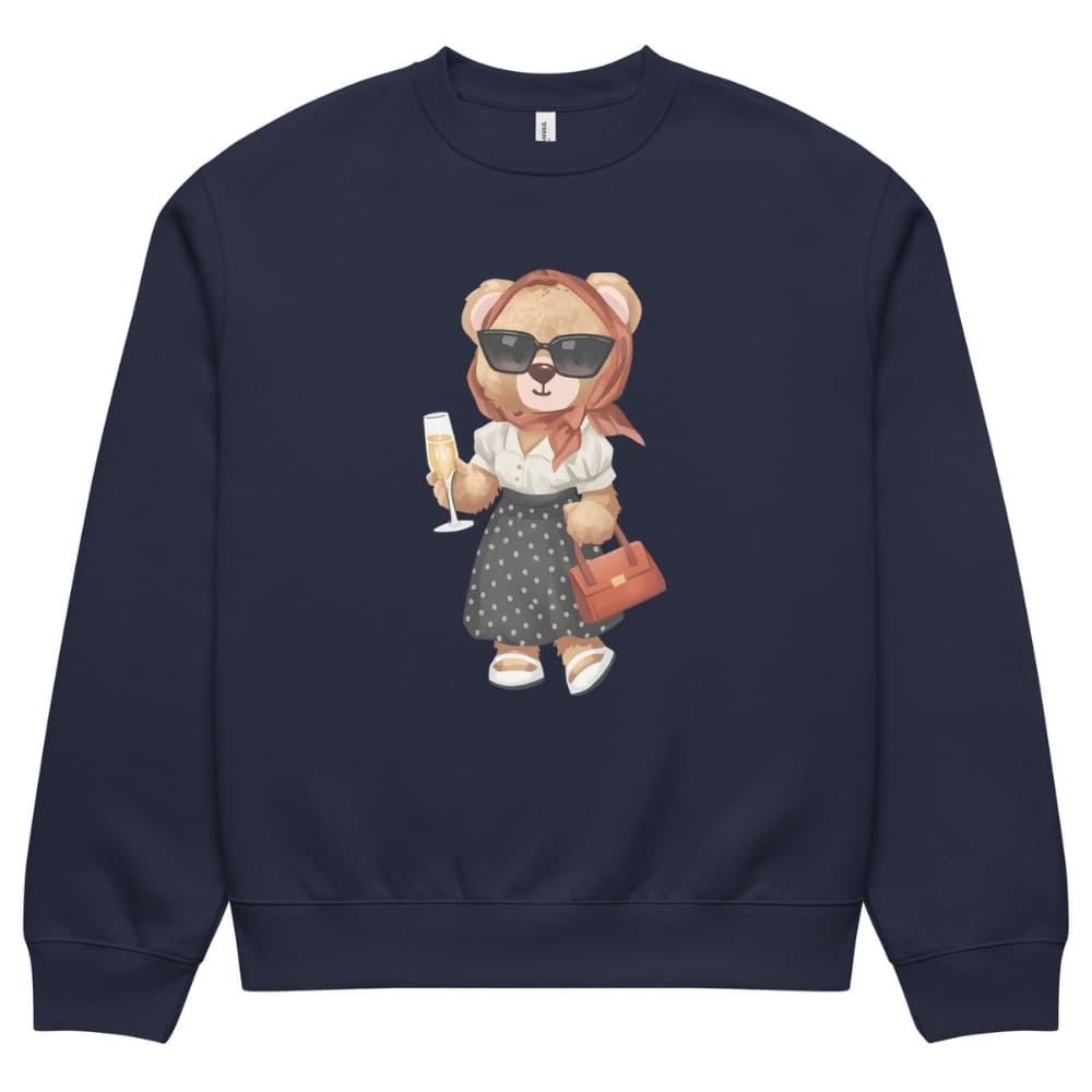 Navy blue sweatshirt with a teddy bear design holding a glass and handbag on a white background
