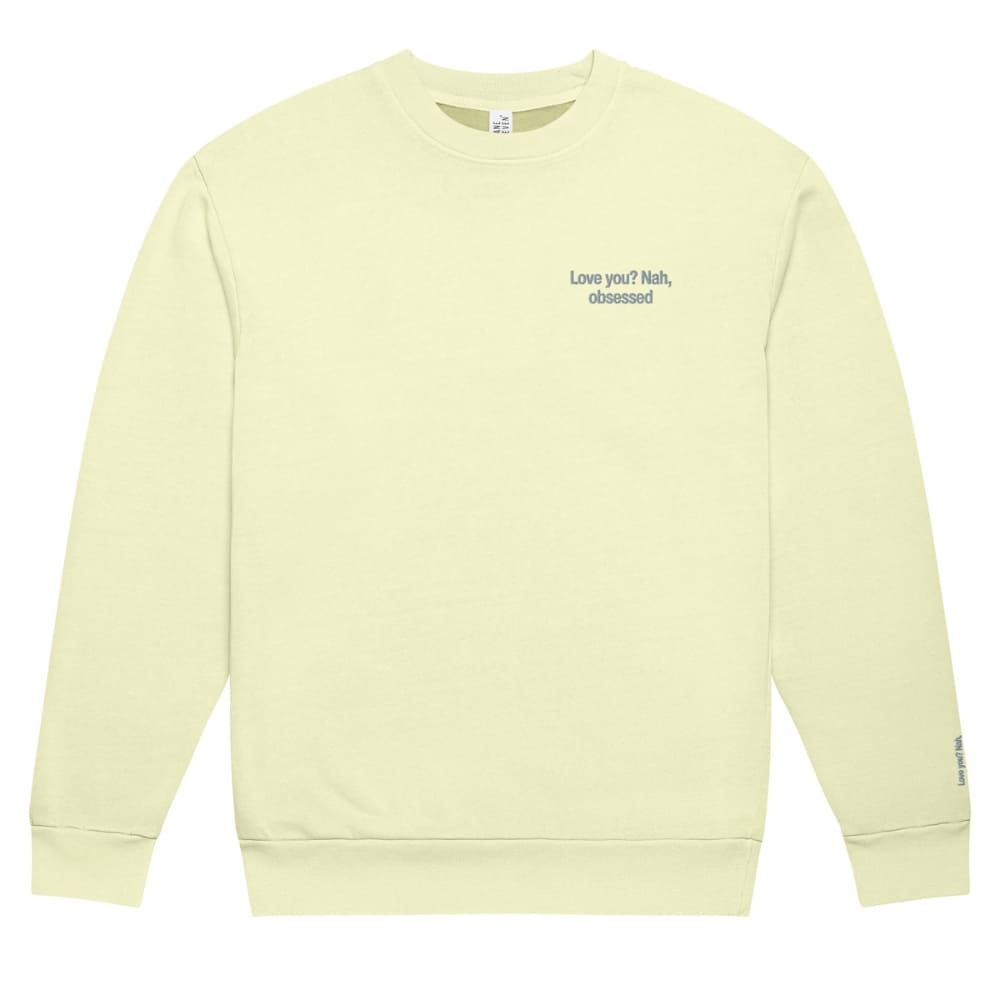 Light yellow sweatshirt with text on a white background