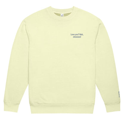 Light yellow sweatshirt with text on a white background
