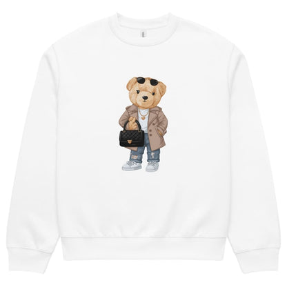 White sweatshirt with a teddy bear graphic holding a handbag on a white background
