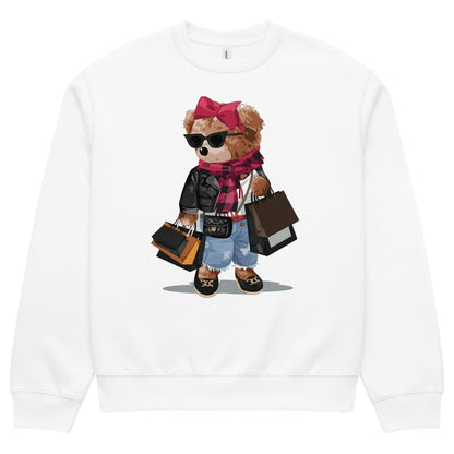White sweatshirt with a teddy bear graphic wearing sunglasses, a pink bow, and holding shopping bags.