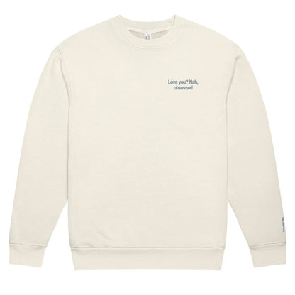 Beige sweatshirt with text on a white background