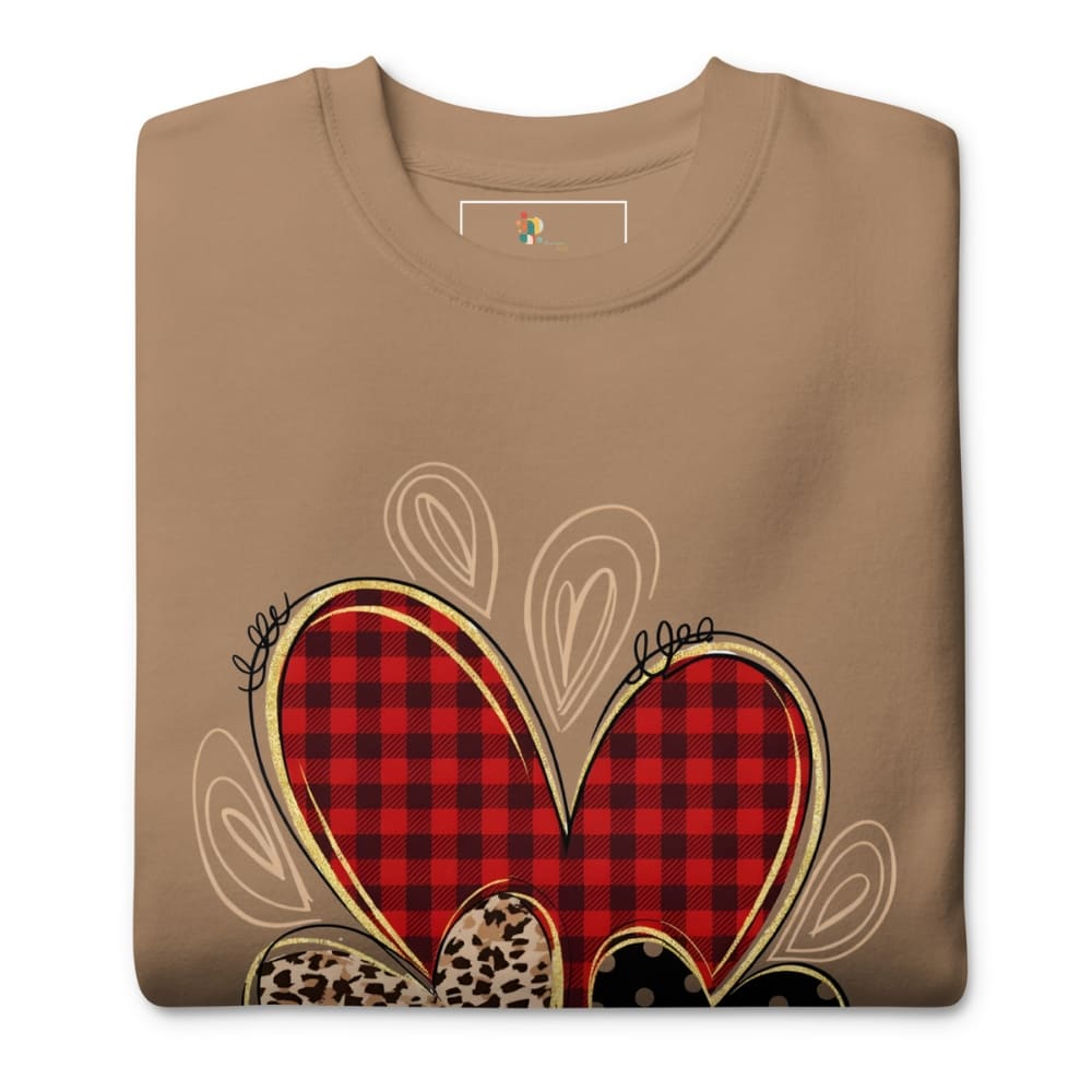 Folded brown t-shirt with a red plaid heart design on a white background