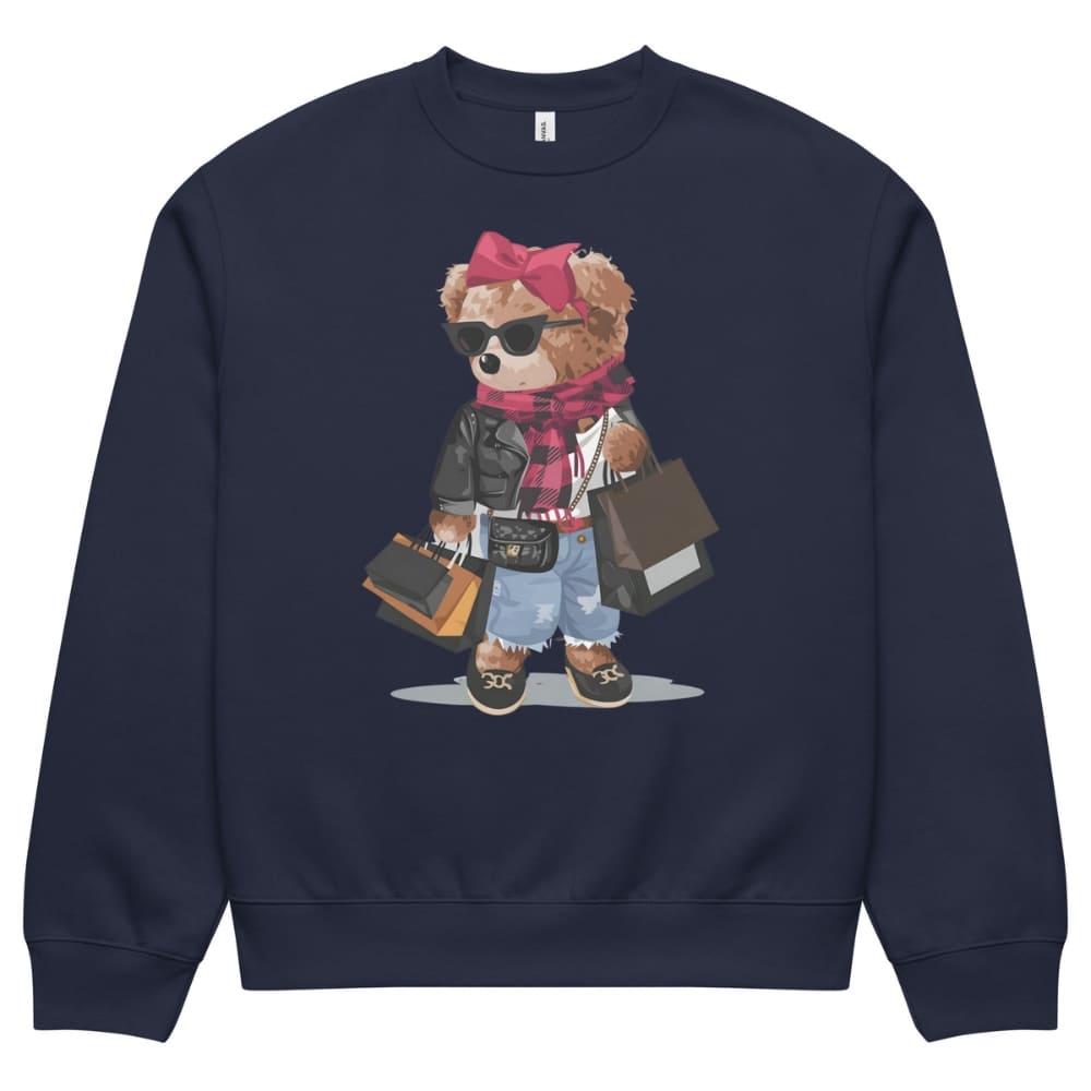Navy blue sweatshirt with a teddy bear graphic wearing sunglasses, a pink bow, and holding bags on a white background.