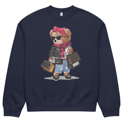 Navy blue sweatshirt with a teddy bear graphic wearing sunglasses, a pink bow, and holding bags on a white background.