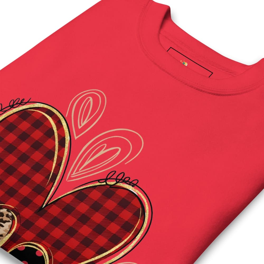 Red t-shirt with plaid heart design on a white background