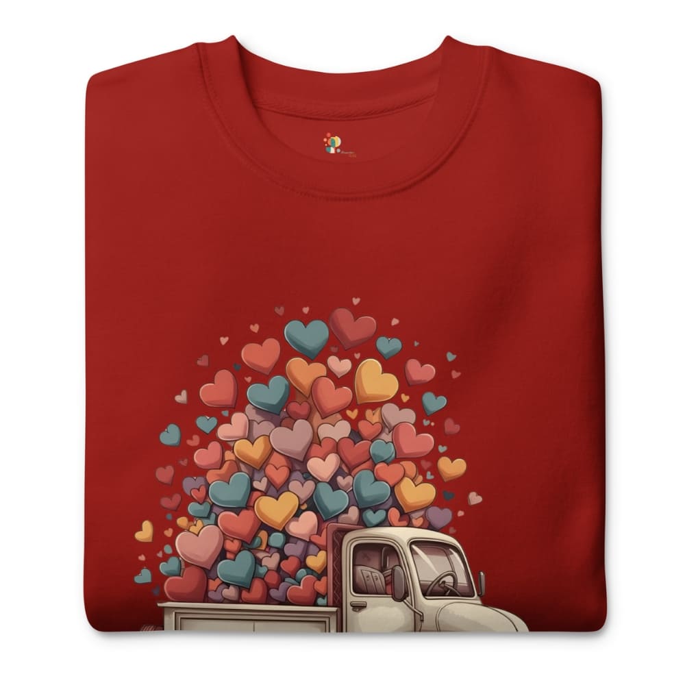 Red t-shirt with a graphic of a truck and colorful hearts on a white background
