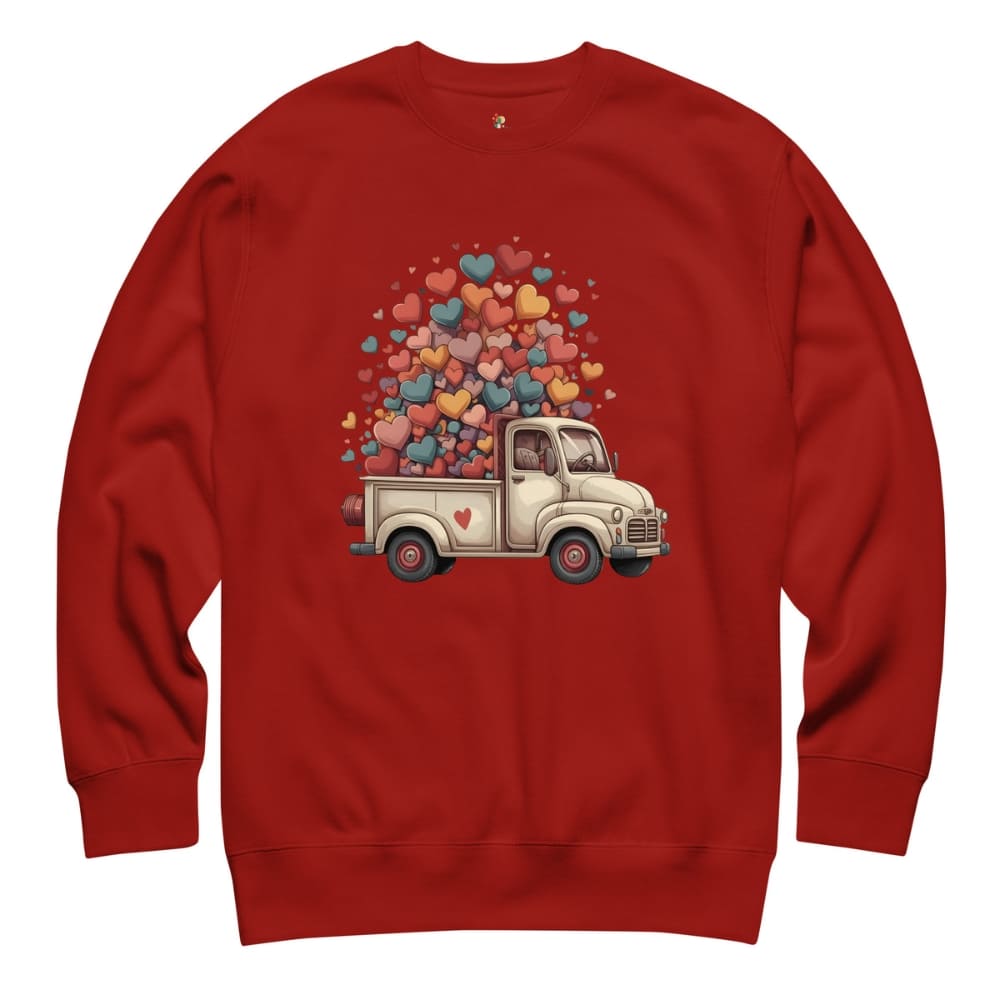 Red sweatshirt with a graphic of a truck carrying colorful hearts on a white background