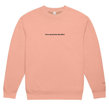 Pink sweatshirt with text on a white background
